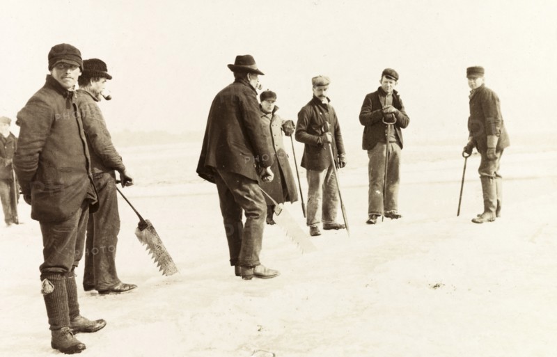Ice cutters on Lake Ontario. A team of ice cutters, ice saws in hand, prepare to remove ice from Lake Ontario to store in a nearby icehouse. Hamilton, Canada, February 1902. Hamilton, Ontario, Canada, North America, North America .