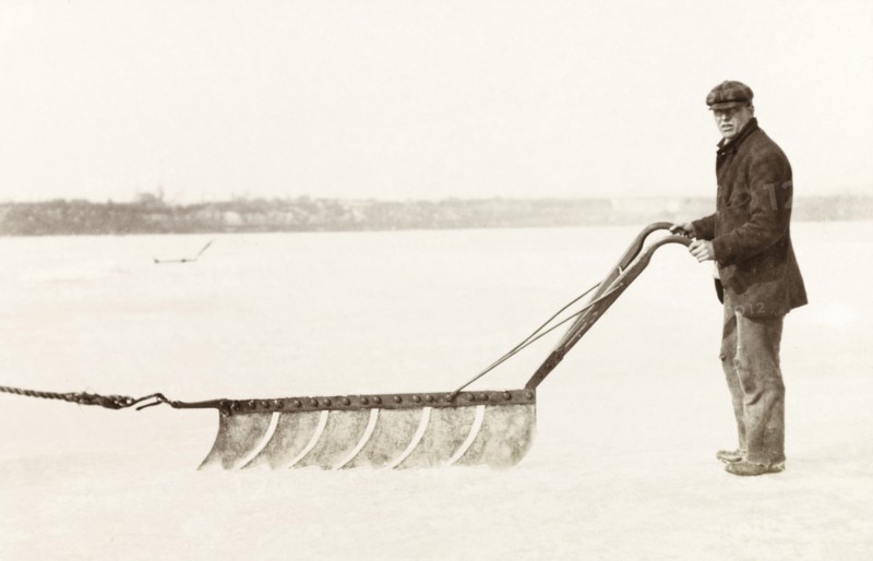 Cutting ice, Canada. An ice cutter steers a horse-drawn ice saw while removing ice from Lake Ontario. Hamilton, Canada, February 1902. Hamilton, Ontario, Canada, North America, North America .