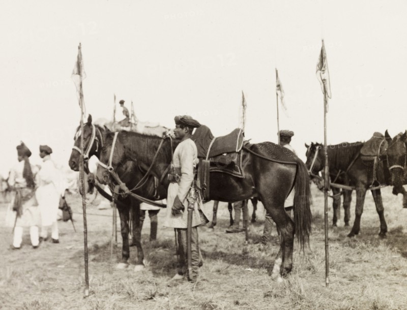 Lancers at Coronation Durbar, 1903. An Indian mounted infantry unit stand with their horses, lances stabbed into the ground beside them, at Edward VII's Coronation Durbar. Delhi, India, circa 1 January 1903. Delhi, Delhi, India, Southern Asia, Asia.