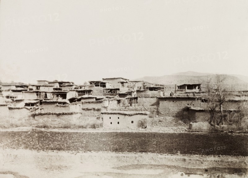 Mud village in North West Frontier Province. View of a village along the Kohat-Thal railway line, where the buildings consist of mud or adobe walls with flat, thatched roofs. North West Frontier Province, India (Pakistan), 1903., North West Frontier Province, Pakistan, Southern Asia, Asia.