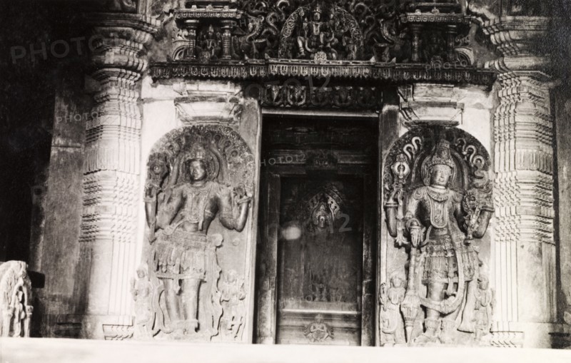 Sculptures at Chennakesava Temple. Two ornately sculpted 'doorkeepers' flank an image of Kesava (Lord Krishna) at Chennakesava Temple, a 12th century Vaishnava temple built by King Vishnuvardhana of the Hoysala dynasty. Belur, Mysore State (Karnataka), India, circa 1937., Karnataka, India, Southern Asia, Asia.