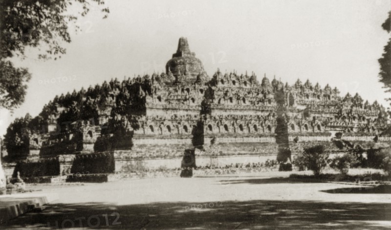 Borobudur, Java. View of Borobudur, a ninth century Buddhist monument that comprises nine tiered platforms decorated with relief panels and 72 stupas containing statues of the Buddha. Java, Indonesia, July 1940., Java, Indonesia, South East Asia, Asia.