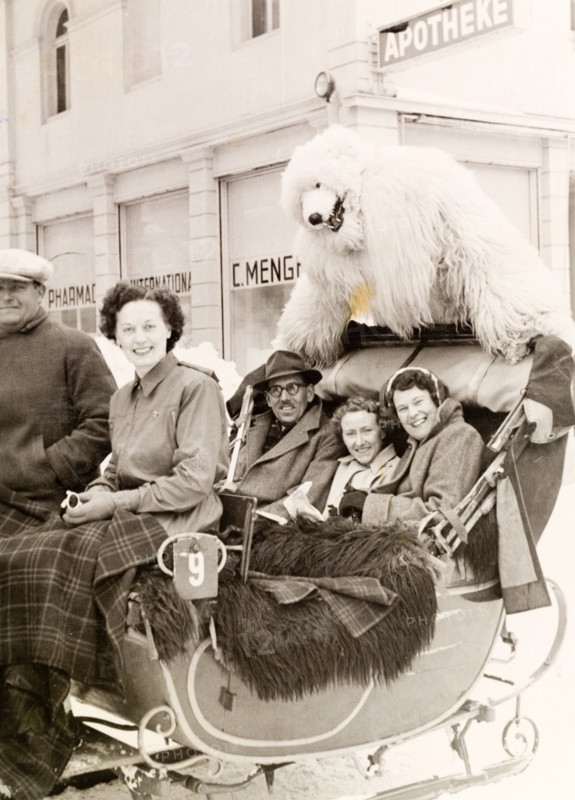 Sleigh ride with a polar bear, Switzerland. A group of British tourists pose with a performer in polar bear costume as they enjoy a sleigh ride at a ski resort. Davos, Switzerland, 1951. Davos, Switzerland, Switzerland, Central Europe, Europe .