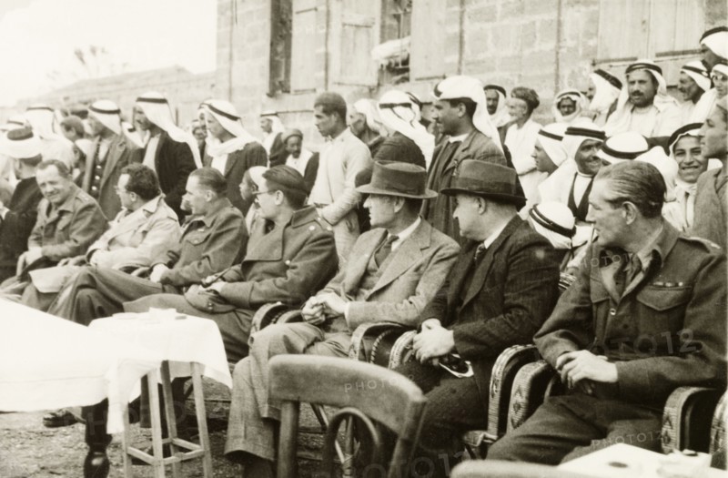 Recruitment meeting at Al Faluja. William Ryder McGeagh (third from right), District Commissioner in Jerusalem, attends a military recruitment meeting in the Arab village of Al Faluja. Al Faluja, British Mandate of Palestine (South Israel), 1944., South (Israel), Israel, Middle East, Asia.