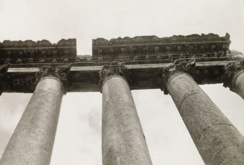 Corinthian columns at Baalbek. Upward view of the Corinthian columns at Baalbek, once one of the largest colonies in the Roman Empire and originally known as Heliopolis. Baalbek, French Mandate of Lebanon (Lebanon), April 1944. Baalbek, Beqaa, Lebanon, Middle East, Asia.