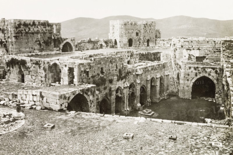Inside the Krak de Chevaliers. The ruined interior of the Krak de Chevaliers, a prominent hill fortress in the Homs Gap. Once the headquarters of the Knights Hospitaller during the Crusades (1095-1291), it controlled the road to the Mediterranean and is one of many fortresses that formed a defensive network along the border of the old Crusader states. Homs (Hims), French Mandate of Syria, 1944. Hims, Syria, Syria, Middle East, Asia.