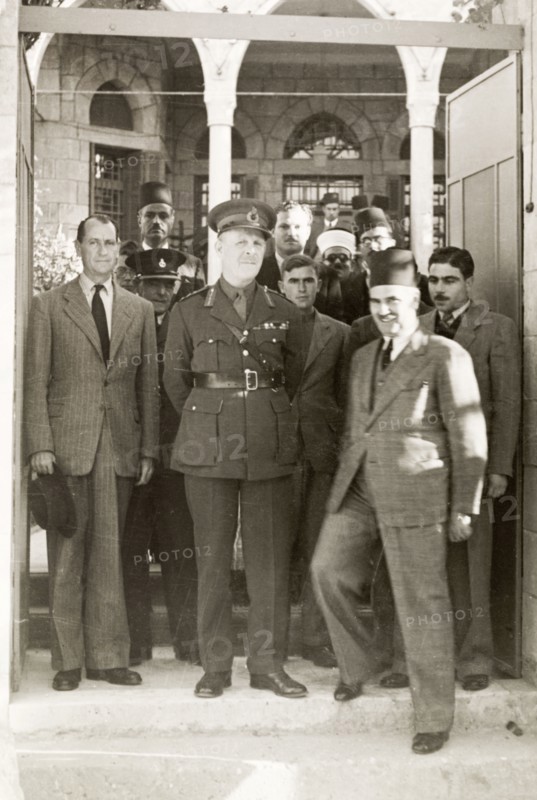 Lord Gort visits Gaza. Lord Gort (centre), the newly appointed High Commissioner of Palestine and Transjordan, poses for photographers with British and Arab officials. To his right stands William Ryder McGeagh, District Commissioner in Jerusalem. Gaza, British Mandate of Palestine (Gaza Strip, Middle East), 4 December 1944. Gaza, Gaza Strip, Gaza Strip (Palestine), Middle East, Asia.
