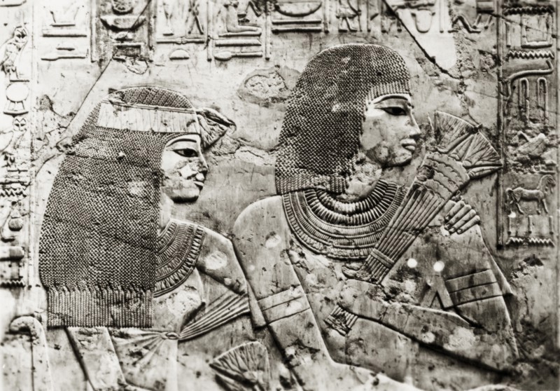 Relief carving at the Tomb of Ramose. Close-up shot of a relief carving on the east wall of the Tomb of Ramose, a Governor and Vizier (administrator) of Ancient Egypt. Depicted in profile are an Egyptian man and woman, guests at Ramose's funeral banquet, surrounded by hieroglyphs. Sheikh Abd el-Qurna near Luxor, Egypt, February 1945. Luxor, Qina, Egypt, Northern Africa, Africa.