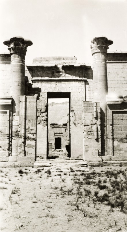 Mortuary Temple of Ramesses III. Two stone pillars stand either side of a gateway decorated with hieroglyphs at the Mortuary Temple of Ramesses III. Medinet Habu near Luxor, Egypt, February 1945. Luxor, Qina, Egypt, Northern Africa, Africa.