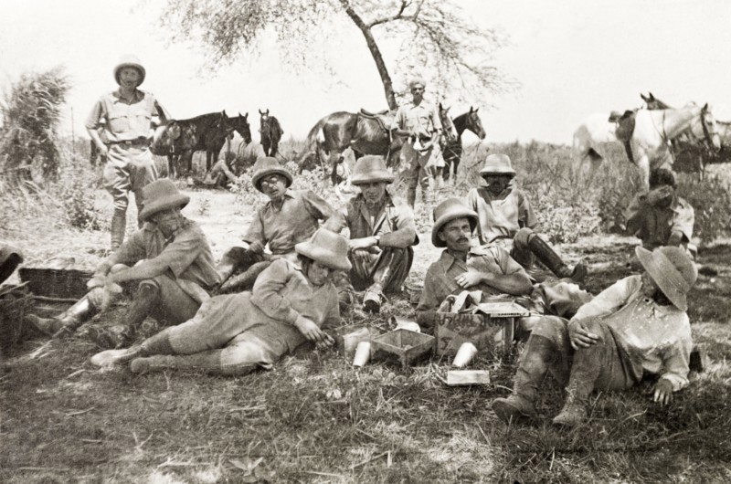 Men from the Police Training School. A group of men from the Police Training School at Moradabad stop for a break beneath a shady tree during a pig sticking hunt. Near Moradabad, United Provinces (Uttar Pradesh), India, circa 1933. Moradabad, Uttar Pradesh, India, Southern Asia, Asia.
