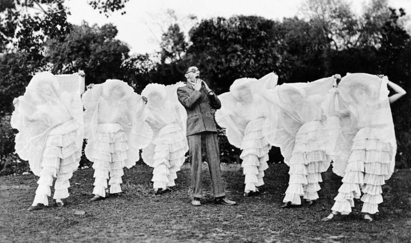 Pantaloon pantomime. Members of the cast of 'Flying Fragments' in hoop skirts, performed by the Moradabad Amateur Dramatic Society at the Railway Institute. The ma in the centre is Reverend B Stratton playing the character of Professor Sparrow-Hawk. Moradabad, United Provinces (Uttar Pradesh), India, 12 February 1934., Uttar Pradesh, India, Southern Asia, Asia.