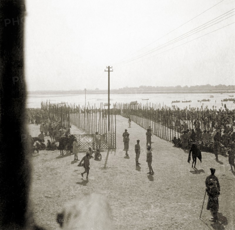 Procession route to the Triveni Sangam. Staked fences mark the procession route down to the Triveni Sangam (the holy confluence of the Yamuna, Saraswati and Ganges Rivers) at the Ardh Kumbh Mela. Allahabad, United Provinces (Uttar Pradesh), India, January 1936. Allahabad, Uttar Pradesh, India, Southern Asia, Asia.