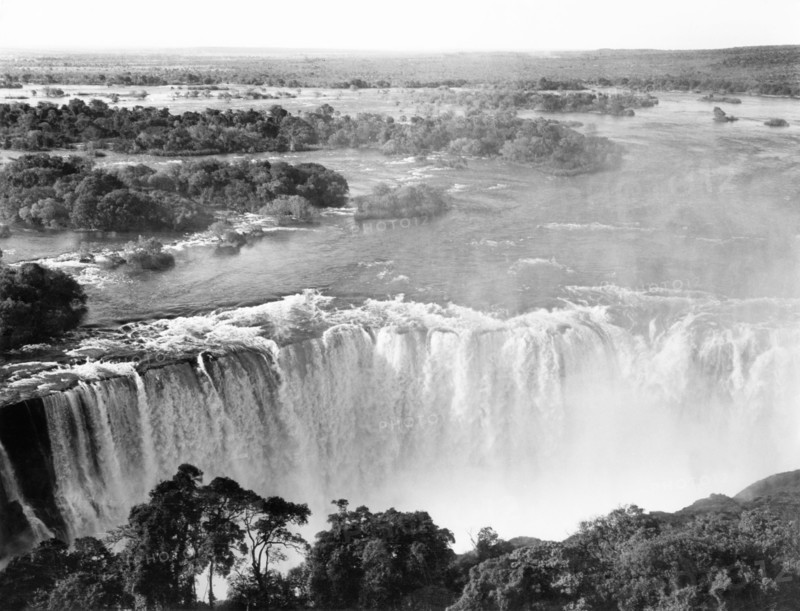 Victoria Falls, circa 1963. A government publicity shot of Victoria Falls, situated on the Zambezi River between modern-day Zambia and Zimbabwe and known locally as 'Mosi-oa-Tunya' or the 'smoke that thunders'. Matabeleland, Southern Rhodesia (Matabeleland North, Zimbabwe), circa 1963., Matabeleland North, Zimbabwe, Southern Africa, Africa.