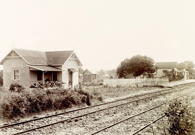 Arouca railway station, Trinidad. Arouca railway station on the Sangre Grande railway line. An original caption identifies the building next door as the 'Collector's Residence'. Arouca, Trinidad, circa 1912. Arouca, Trinidad and Tobago, Trinidad and Tobago, Caribbean, North America .