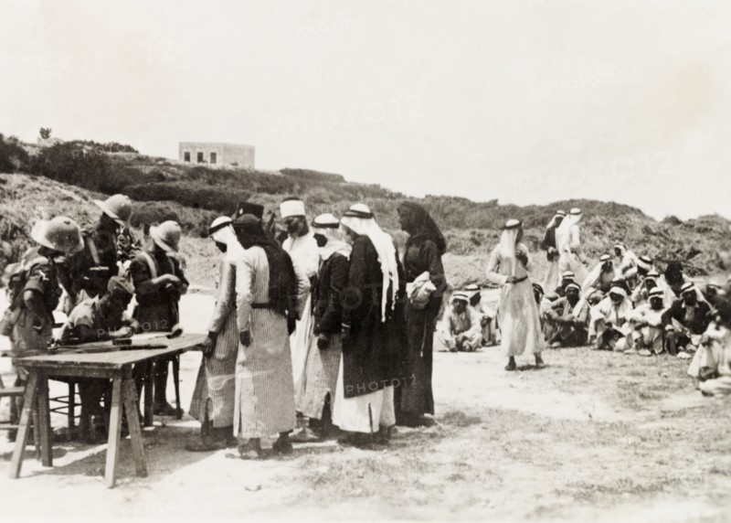 British military questioning Palestinian Arabs. British military officers question a group of Arab villagers. During the period of the Great Uprising (1936-39), an additional 20,000 British troops were deployed to Palestine in an attempt to clamp down on Arab dissidence. British Mandate of Palestine (Middle East), circa 1938., Middle East, Asia.