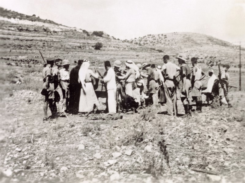 Searching a group of Arab villagers. British soldiers search a group of Palestinian Arab villagers for evidence of rebel activity. During the period of the Great Uprising (1936-39), an additional 20,000 British troops were deployed to Palestine in an attempt to clamp down on Arab dissidence. British Mandate of Palestine (Middle East), circa 1938., Middle East, Asia.