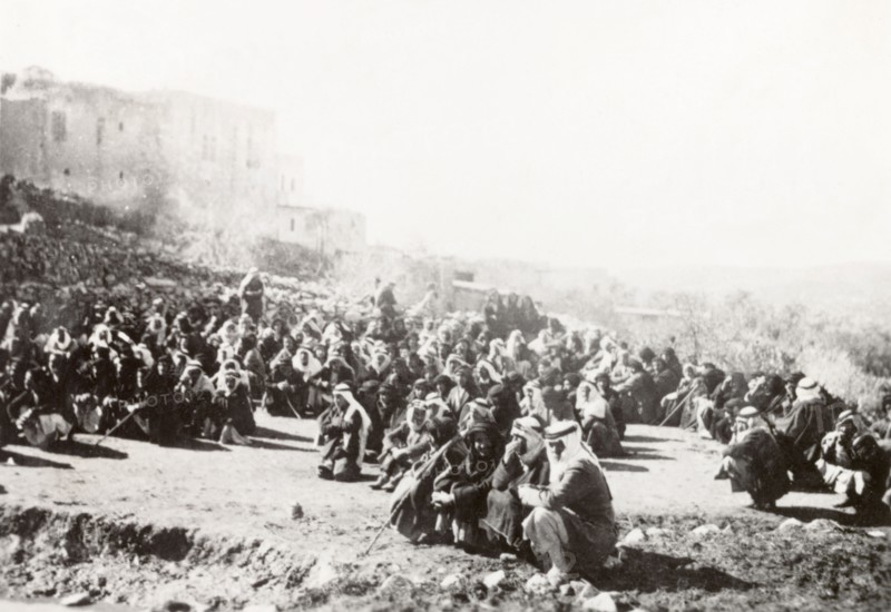 Searching a Palestinian village. The inhabitants of Al Sita are detained outdoors whilst British troops search the village for evidence of rebel activity. During the period of the Great Uprising (1936-39), an additional 20,000 British troops were deployed to Palestine in an attempt to clamp down on Arab dissidence. Al Sita, British Mandate of Palestine (Middle East), circa 1938., Middle East, Asia.