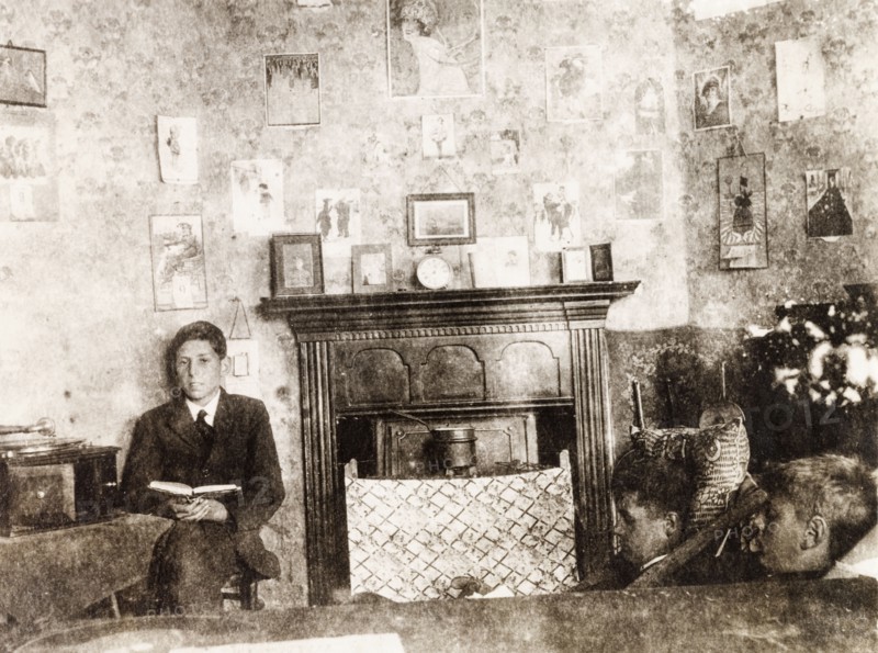 Inside a study room at Eastbourne College. Male students sit and read inside a senior study room in the boy's boarding house at Eastbourne College. Eastbourne, England, circa 1924. Eastbourne, Sussex, England (United Kingdom), Western Europe, Europe .