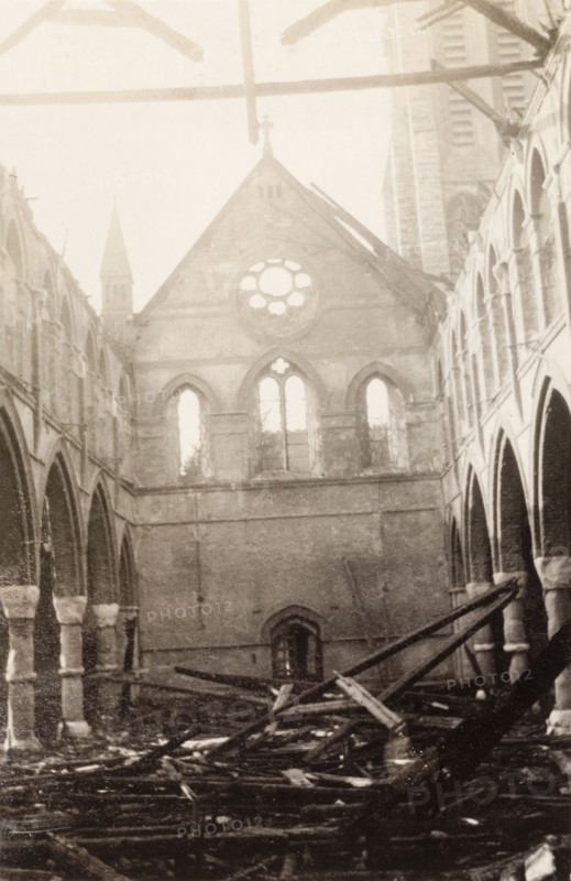 Interior of a fire damaged church. The interior of All Saints Church in Eastbourne in the aftermath of a devastating fire. The stone church stands roofless, its charred roof timbers lying in a tangled mess on the church floor. Eastbourne, England, 1926. Eastbourne, Sussex, England (United Kingdom), Western Europe, Europe .