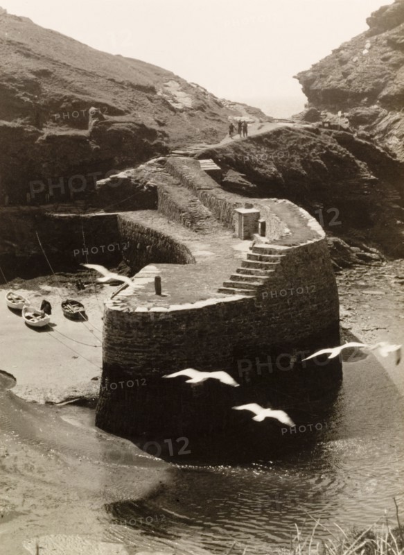 Harbour wall at Boscastle. A stone harbour wall at Boscastle, built to protect the village's natural harbour that stretches for twenty miles along the Cornish coastline. Boscastle, Cornwall, England, circa 1929. Boscastle, Cornwall, England (United Kingdom), Western Europe, Europe .