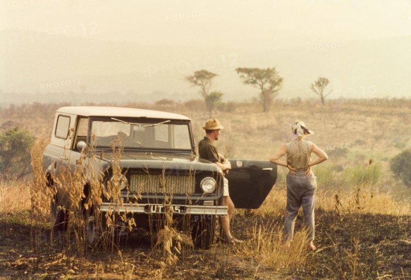 Elisabeth Lang Brown and Svend Sorendsen. Elisabeth, the wife of District Forestry Officer James Lang Brown, surveys the Ankole bush with Svend Sorendsen, a Danish employee of the Tsetse Control Department. West Uganda, March 1964., West (Uganda), Uganda, Eastern Africa, Africa.