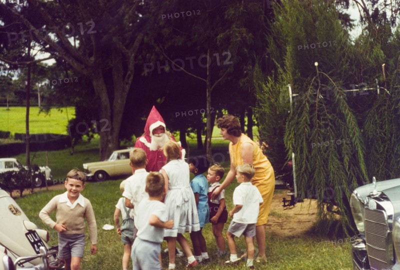 Meeting Father Christmas at Mbarara. A group of European children queue eagerly to meet Father Christmas during Christmas celebrations at Mbarara in Ankole. Mbarara, South West Uganda, December 1963., West (Uganda), Uganda, Eastern Africa, Africa.