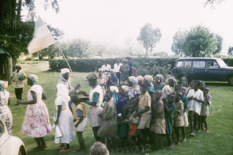 Christmas games. Children prepare for Christmas games outdoors at the Afro-Israel Mission. Kapsimotwa, Kenya, December 1961., Rift Valley, Kenya, Eastern Africa, Africa.