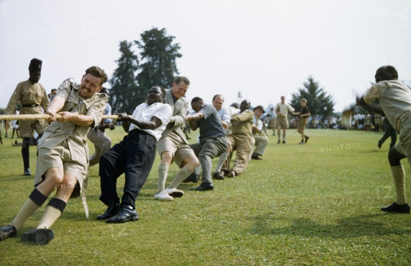 Tug of war in Toro. British and Ugandan men of the Protectorate Police team take part in a tug of war during a sports day in Toro. West Uganda, 1956., West (Uganda), Uganda, Eastern Africa, Africa.