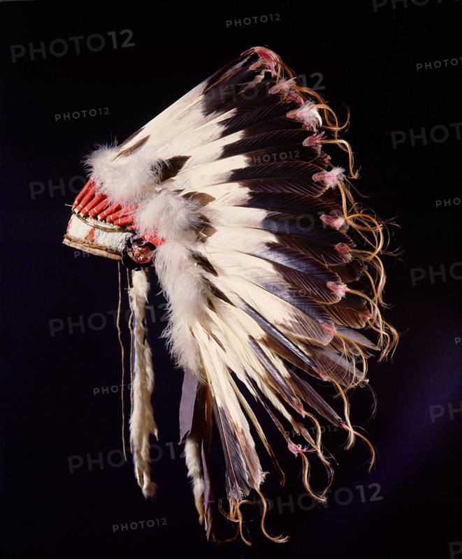 War bonnet of eagle tail feathers, each feather signifying a specific war honour