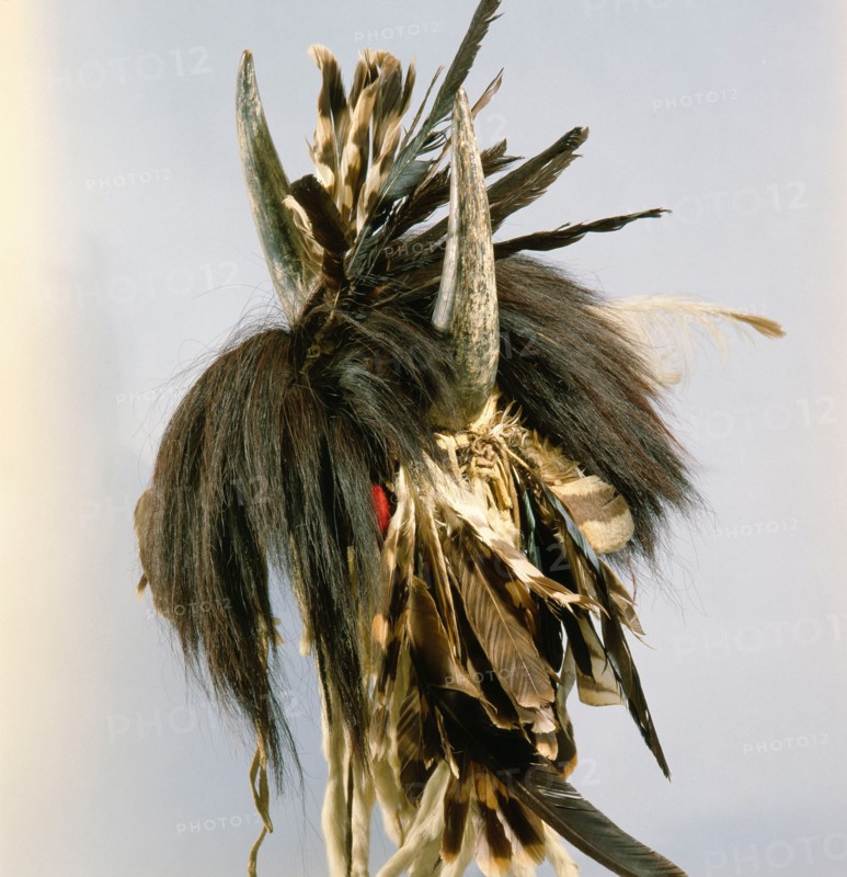 Among the Blackfoot a high position in warrior society might be marked by the wearing of a war cap surmounted by buffalo horns