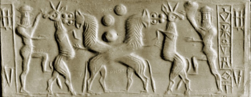 Cylinder seal depicting two crossed lions attacking a horned creature while the bearded hero, conventionally identified as Gilgamesh, assists