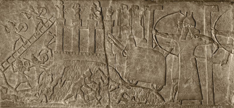 Stone relief from the Palace of Tiglath   Pileser attacking a city with a battering ram