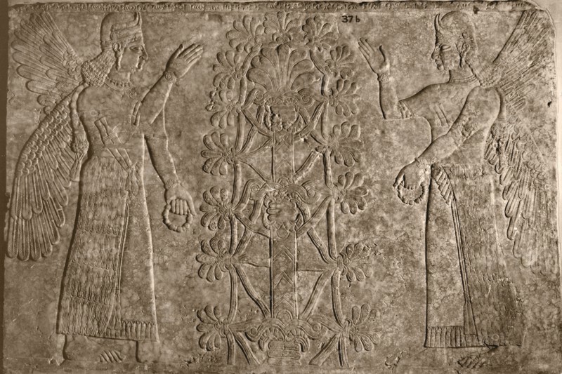 Two winged protective spirits before the sacred tree of life