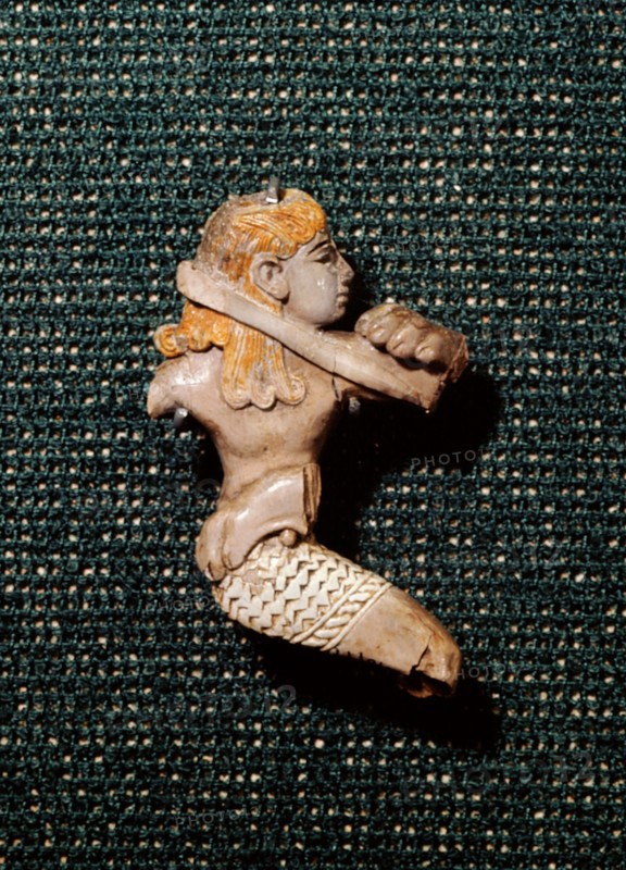 Ivory figure of Phoenician workmanship depicting a man fighting with a lion