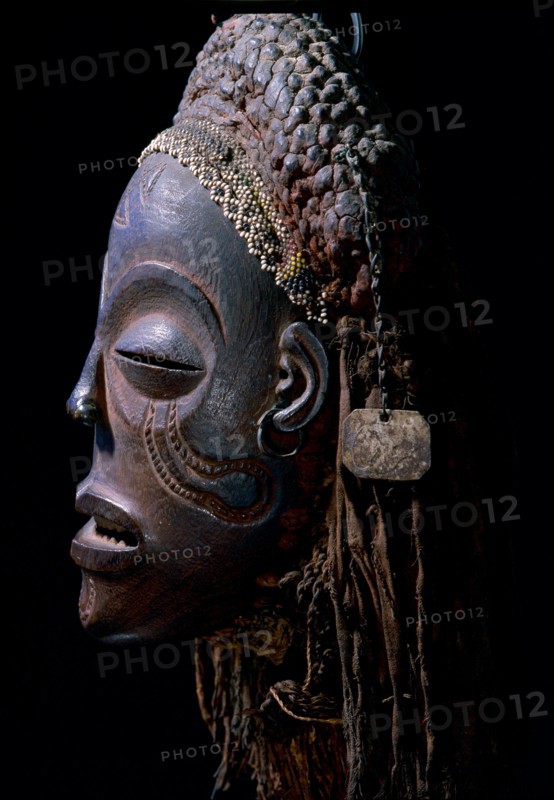Dance mask of a type known as Mwana Pwo, regarded as an idealised depiction of a beautiful young girl, showing facial scarifications