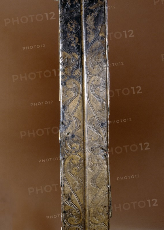 Detail of a bronze sword scabbard showing engraved decoration