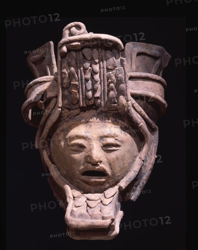 Pottery figurine with elaborate headdress