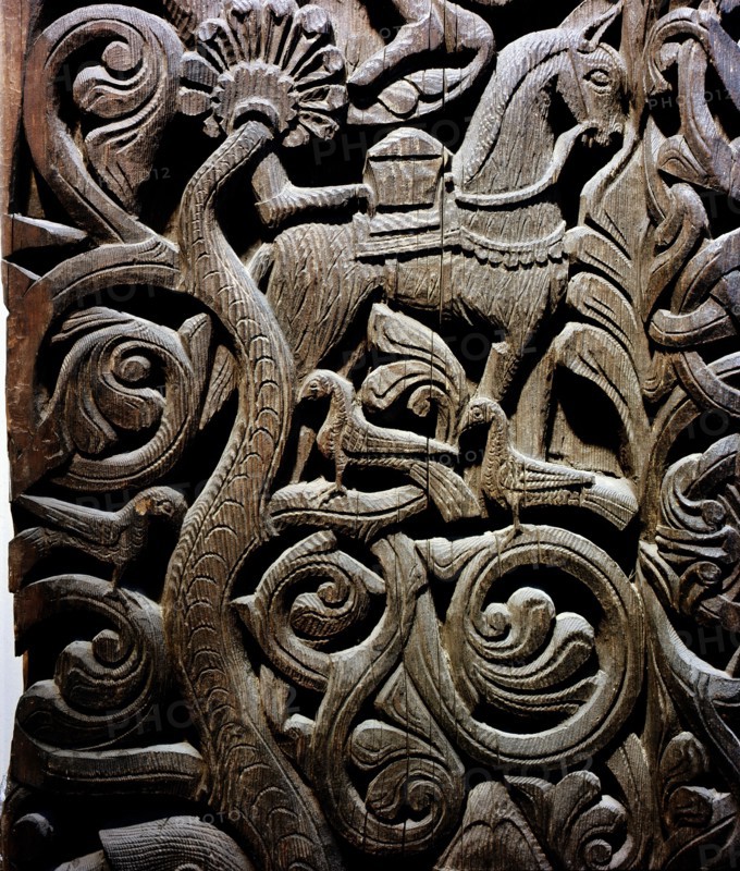 Detail of a carving from a stave church portal illustrating the story of Sigurd