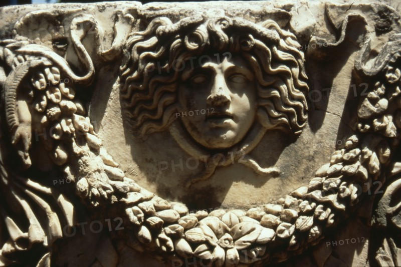 Relief of Medusa head encircled by snakes and garland from a stone sarcophagus