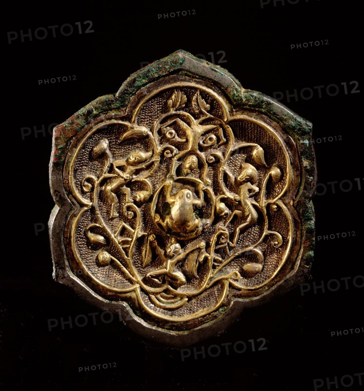 The reverse side of a small bronze lotus shaped mirror