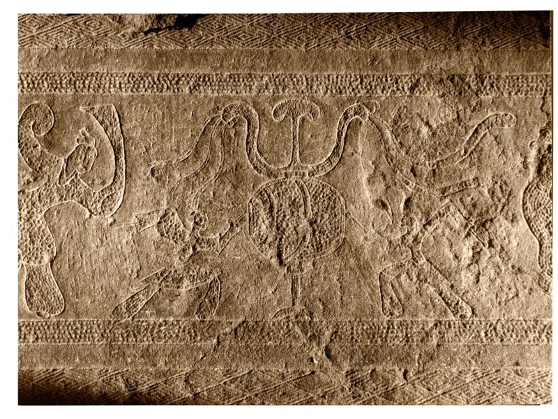 Brick from a tomb structure impressed with a design of dancer and drummers