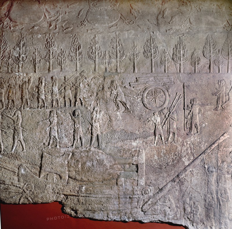 Detail of a relief depicting gangs of slaves hauling and levering a colossal stone bull mounted on a sledge during the building of Sennacheribs palace at Nineveh