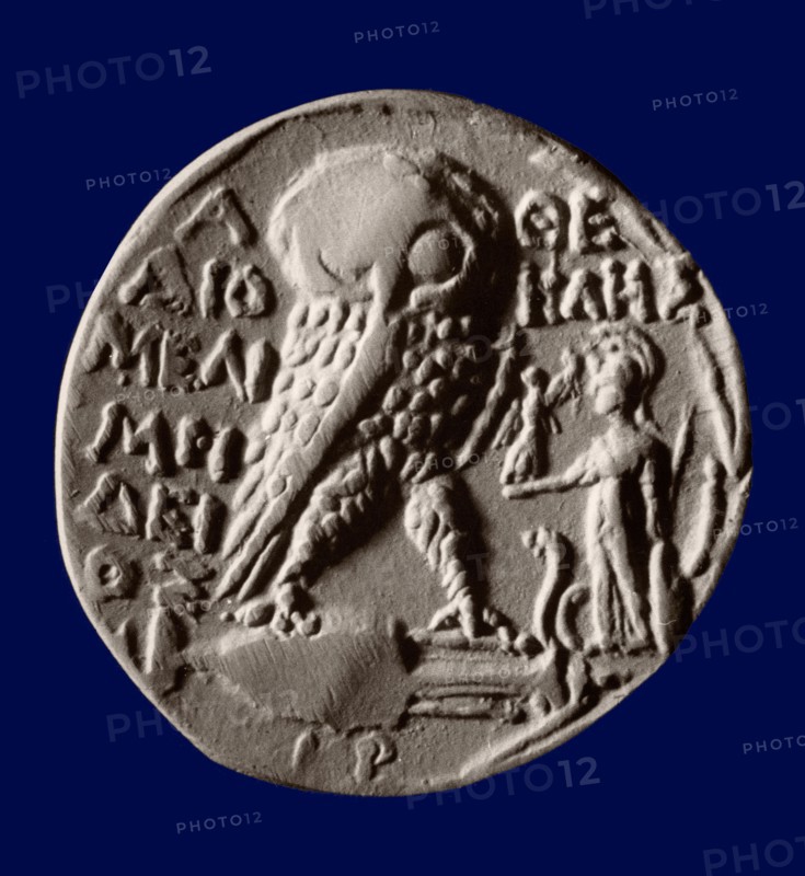 Athenian four drachma (tetradrachm) coin with the symbols of the city, the owl and the statue of Athena Parthenos