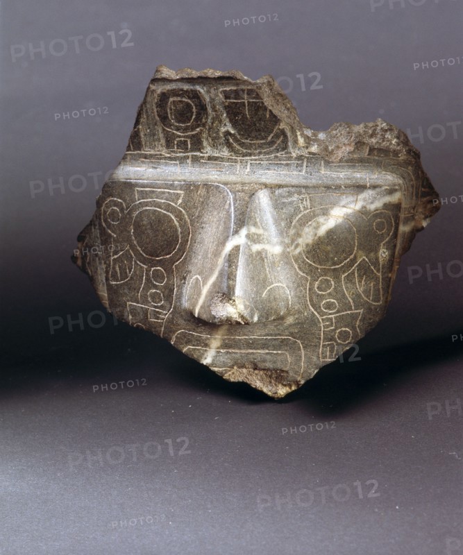 Fragment of a carved stone face with a weeping eye incised design similar to the so called Weeping God on the Gateway of the Sun at the ceremonial centre of Tiahuanaco