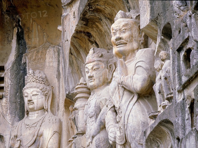 The Guardian kings of Buddhism carved on the north wall of the Fengxian temple at the Longmen cave temple complex