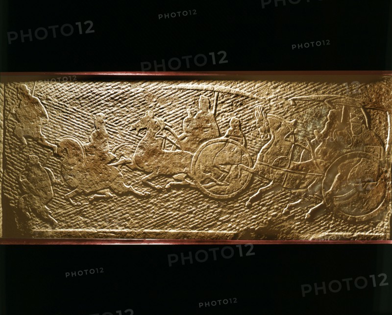 Brick from a tomb structure impressed with design of chariots