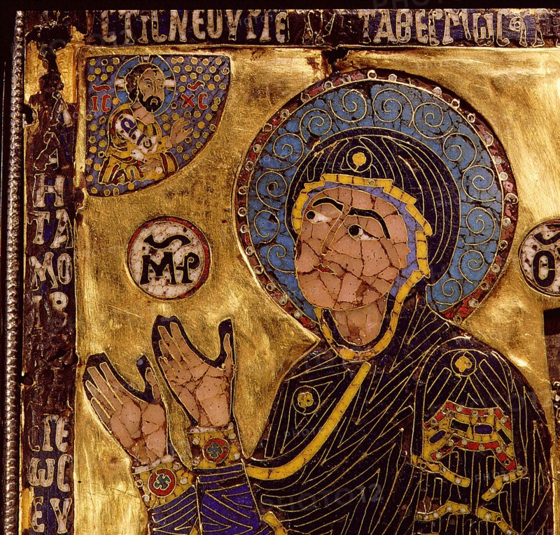 A small gold and enamelled reliquary which would have been worn around the neck to protect the owner from harm