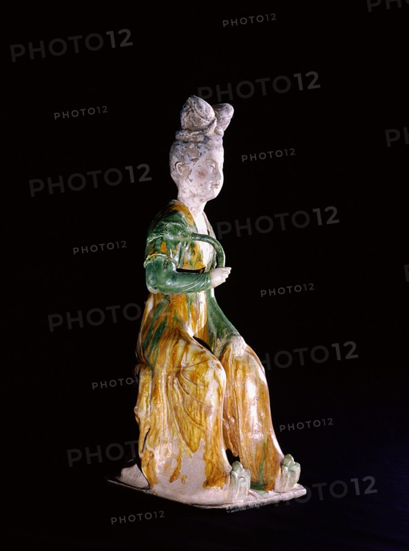 Figure of a seated court lady holding a lotus stem