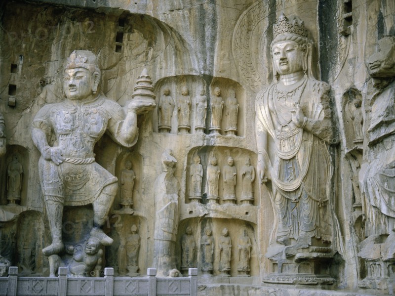 The guardian kings of Buddhism carved on the north wall of the Fengxian temple at the Longmen cave temple complex