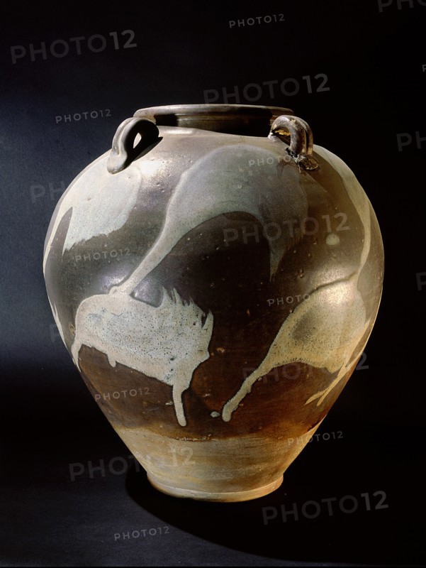 Brown and cream glazed vessel